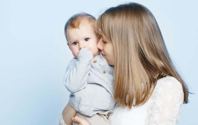 A woman holding a baby